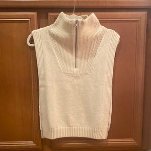 H&M Beige knitted turtle neck tunic open on the sides.